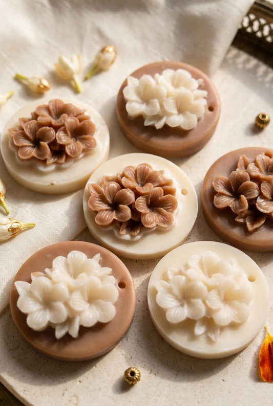 Close-up of handcrafted floral wax sachets in brown and ivory